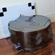 The robovac can always find its way back home to thanks to checkerboard markings on the base.